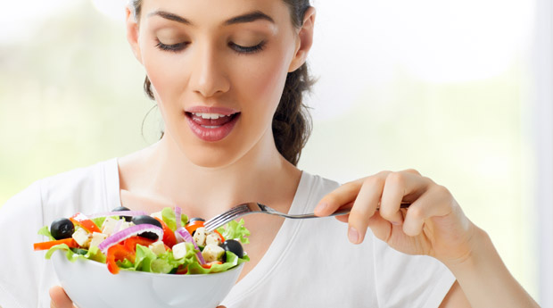 A beautiful girl eating healthy food